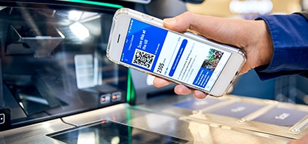 Person scanning Clubcard app to use their vouchers at Esso