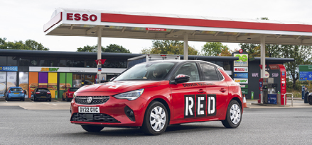 Car with ‘RED driving school logo’ parked at Esso Forecourt