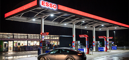 Car driving into Esso service station.