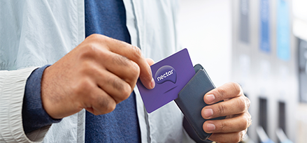 Man holding his Nectar card.